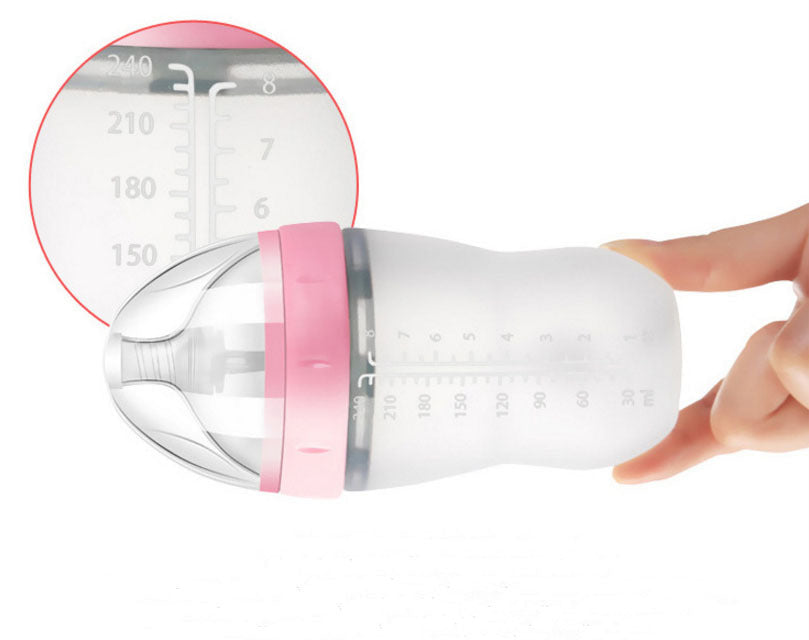 Baby’s bottle with spoon