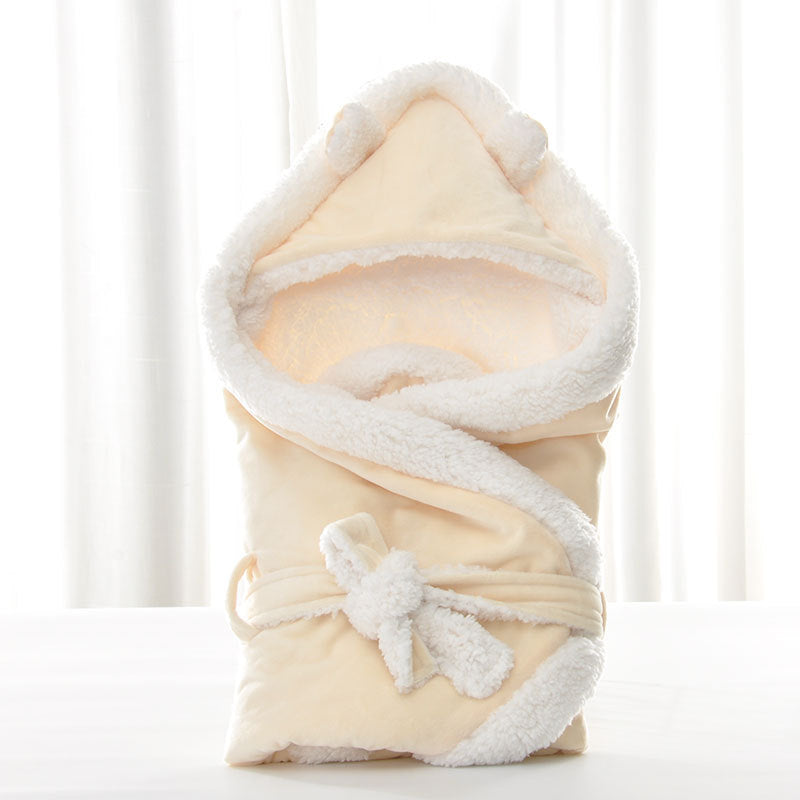 Newborn baby being hugged and swaddled by baby - Yellow
