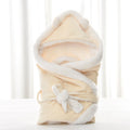 Newborn baby being hugged and swaddled by baby - Yellow